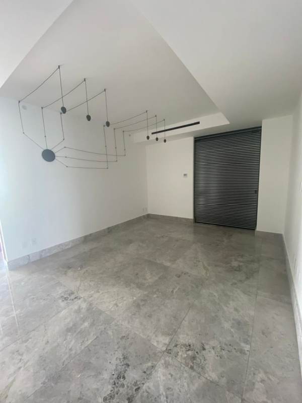 Minimalist entryway with marble floor and large wall mirror Empire Residences Panama