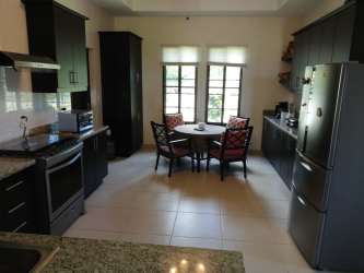 Living room bright windows garden view tiled floors Panama luxury villa