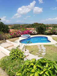 Granite countertop kitchen stainless appliances bright dining area Hacienda Pacífica Panama villa