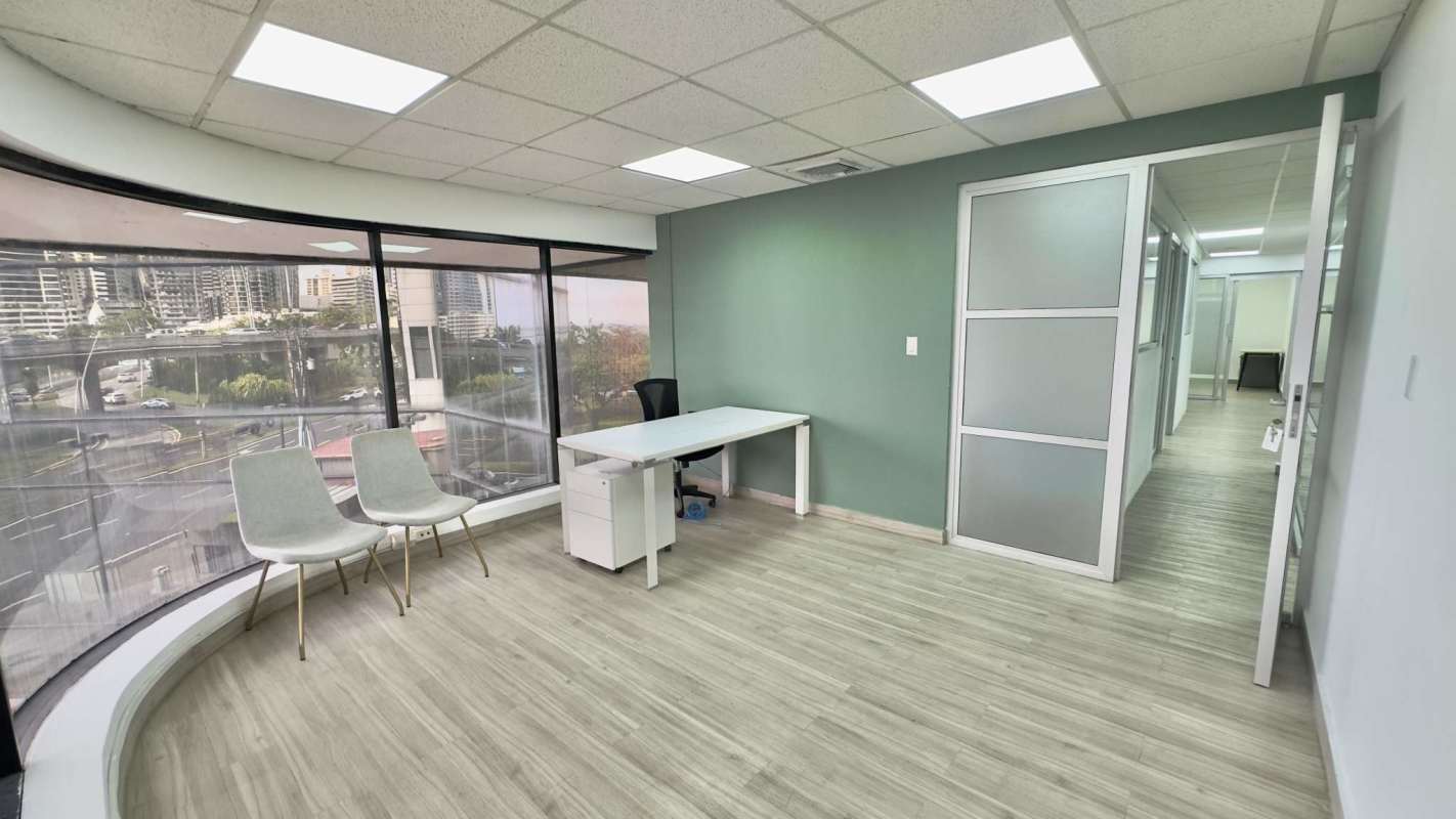 Private office cabin with large curved windows overlooking ocean and skyline Panama PH BICSA Tower