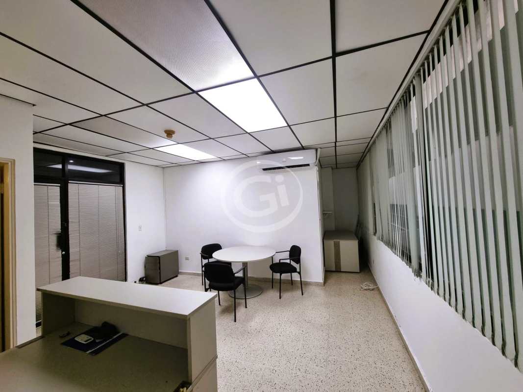 Modern minimalist furnished office with large window, AC, and meeting table in PH BICSA Tower Avenida Balboa Panama