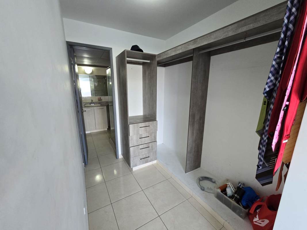 Walk-in closet connected to main bedroom in PH Sabana Tower Carrasquilla Panama City