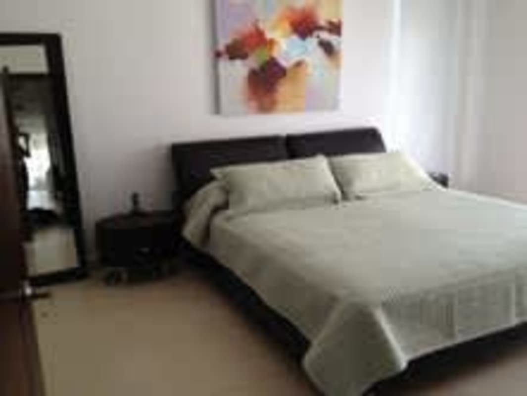 Second bedroom with city skyline view, queen bed, ensuite bath PH Rivage Panama