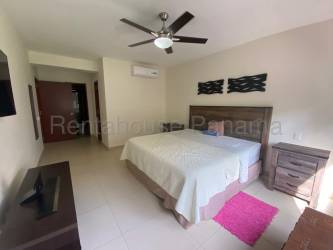 Spacious terrace with BBQ area overlooking green gardens at Panama Pacifico