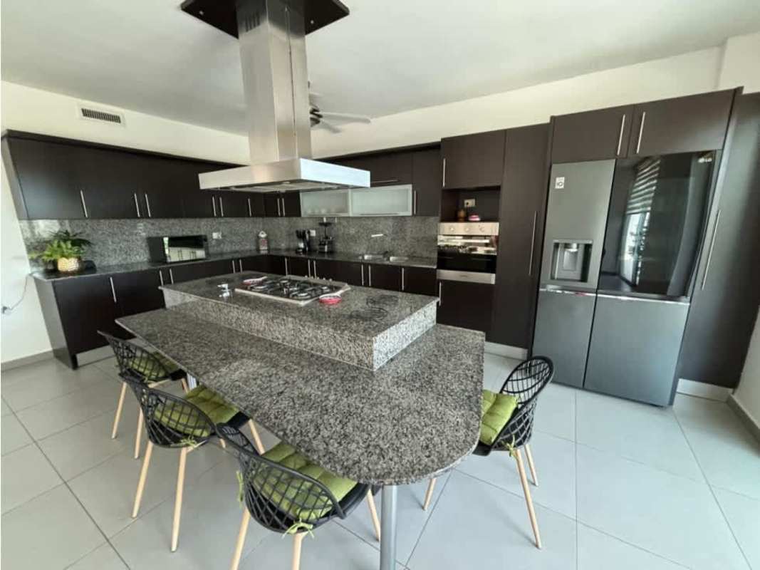 Bright living room with high ceiling, large windows, modern decor in Costa Esmeralda house Panama - Hola Realty