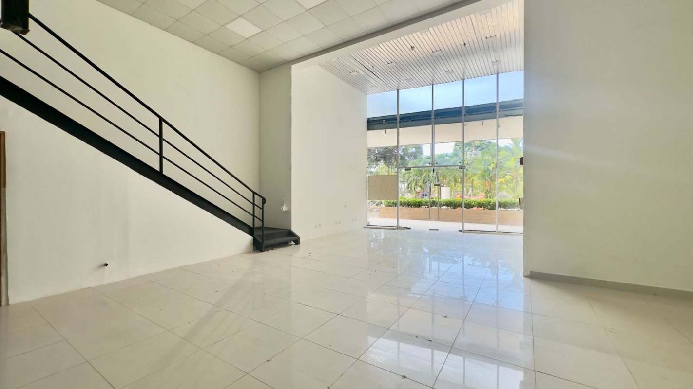 Open tiled commercial interior with mezzanine and natural lighting in Bella Vista Panama