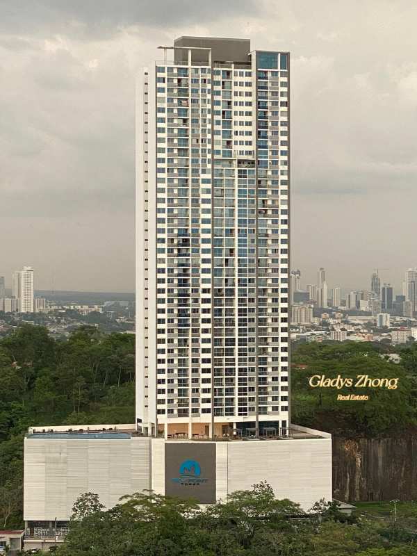 Rooftop infinity swimming pool overlooking city and mountains at PH Sky Point Panama