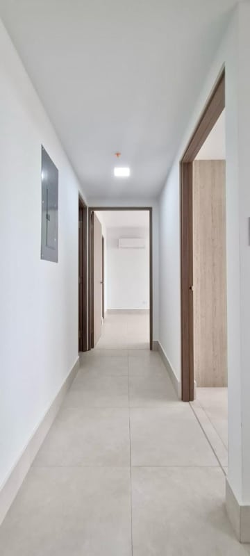 Bright hallway with ceramic tiles and modern minimalist finish at Greenwood Towers Panama
