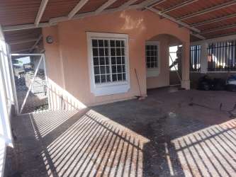 Fenced backyard patio terrace of Montelimar house rental La Chorrera Panama
