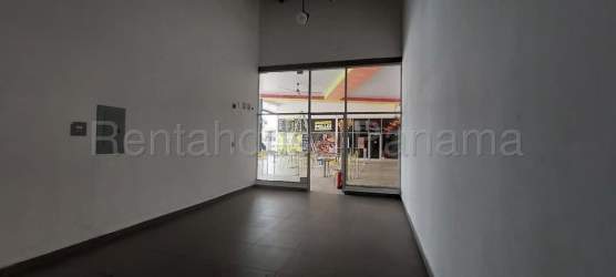 Open commercial retail unit interior white walls glass doors Costa Verde Panama