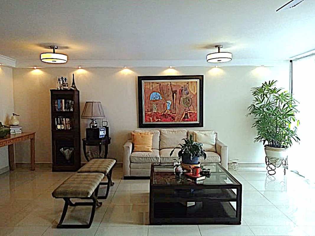 Large bright living room with sofa, modern decor, and tiled floors at PH Cangrejo Plaza Panama
