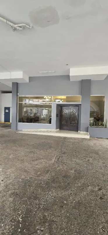 Lobby area with chandeliers and sofa at PH Villa de las Fuentes Panama City