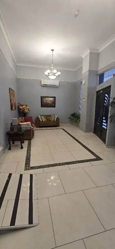 Entrance of PH Villa de las Fuentes with glass facade and decorative door