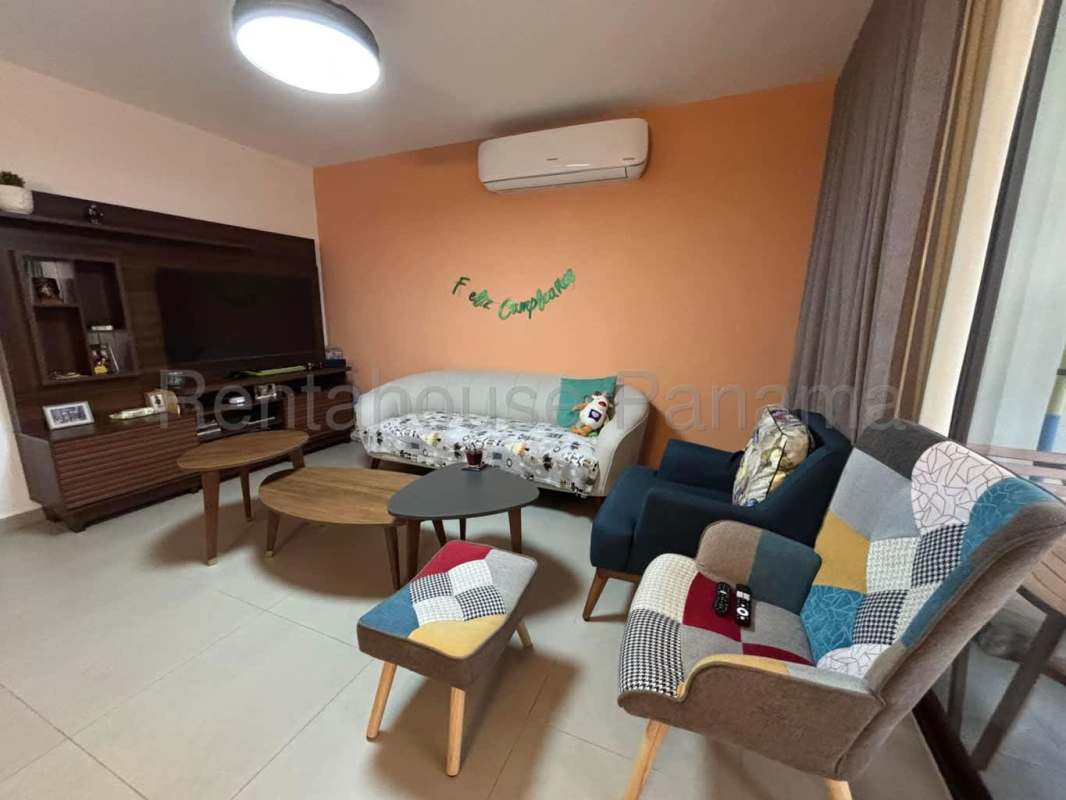 Modern kitchen with appliances and wood cabinetry in Golf Gardens home for rent