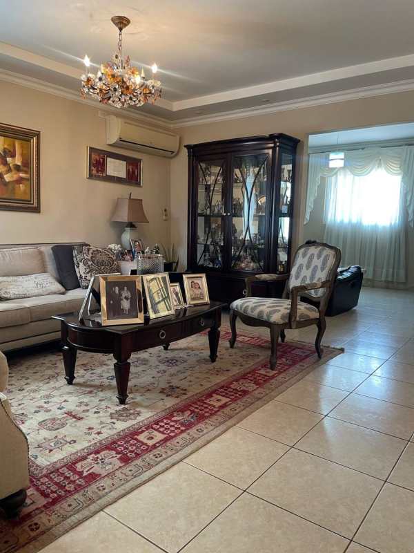 Modern kitchen with granite countertops, white cabinetry in Costa Dorada residence Panama