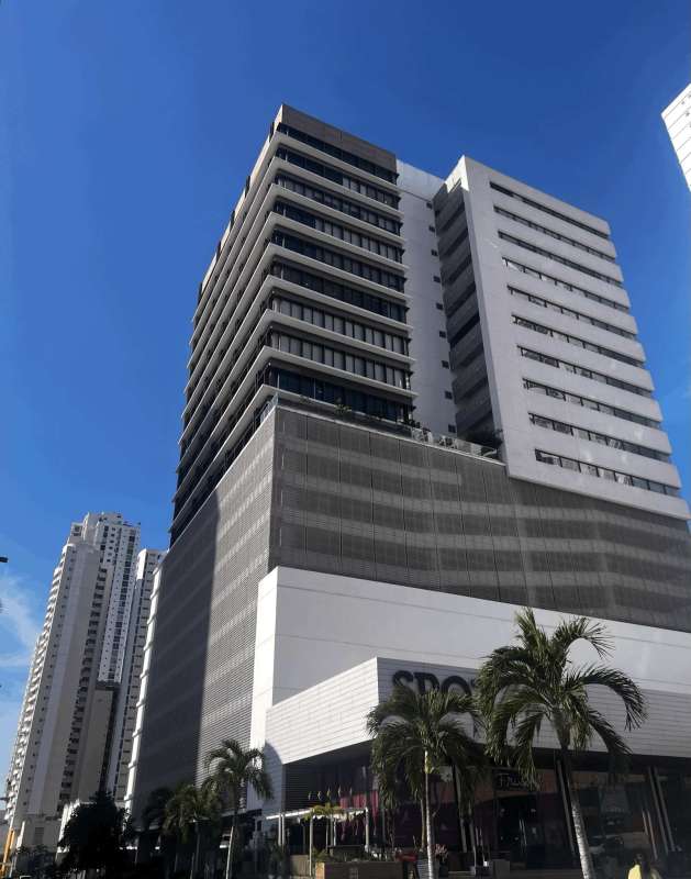 Lobby entrance with illuminated Midtown sign and modern paneling at PH Midtown Panama City
