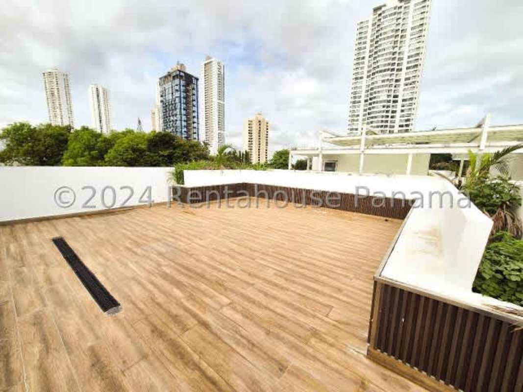 Rooftop terrace with wood tile floor skyline view modern rental house Panama