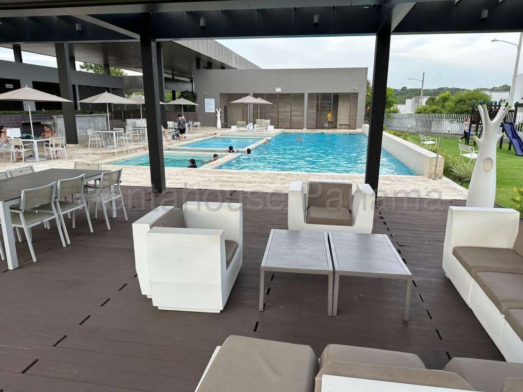 Swimming pool and covered lounge area within PH Victoria gated community Brisas del Golf Panama