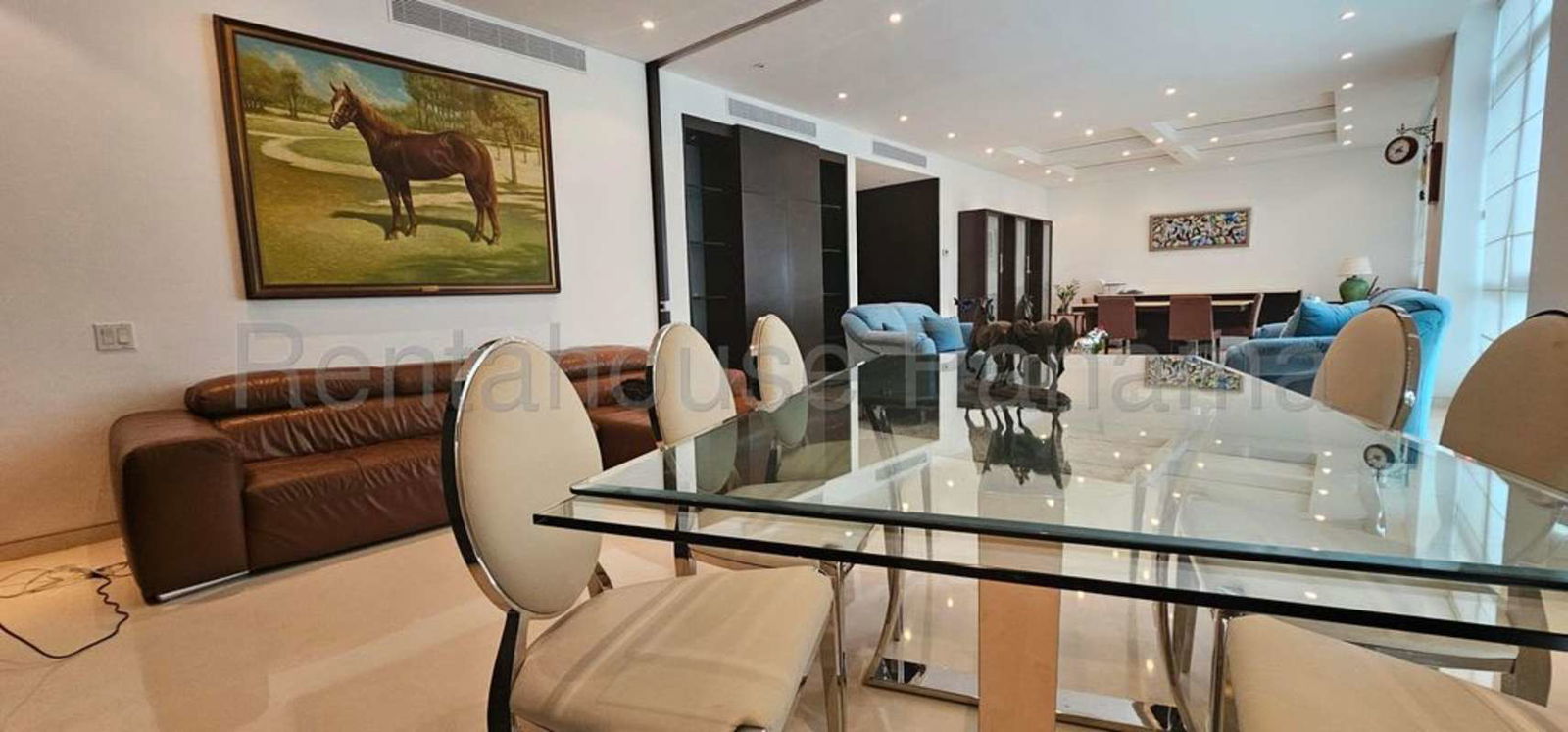 Elegant dining space with Pacific Ocean view adjacent to living area in PH Pacific Point Panama