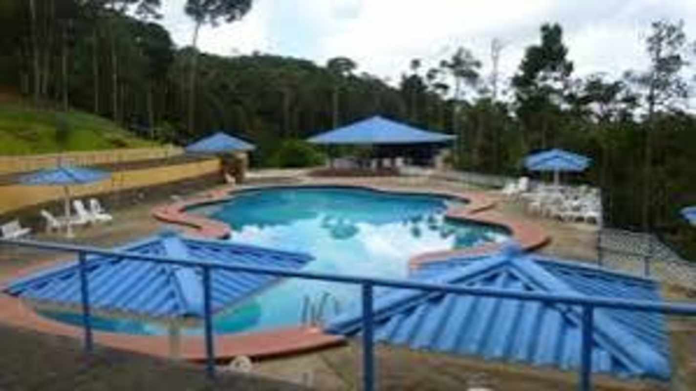 Gated entry and security checkpoint of Los Altos de Cerro Azul residential community Panama