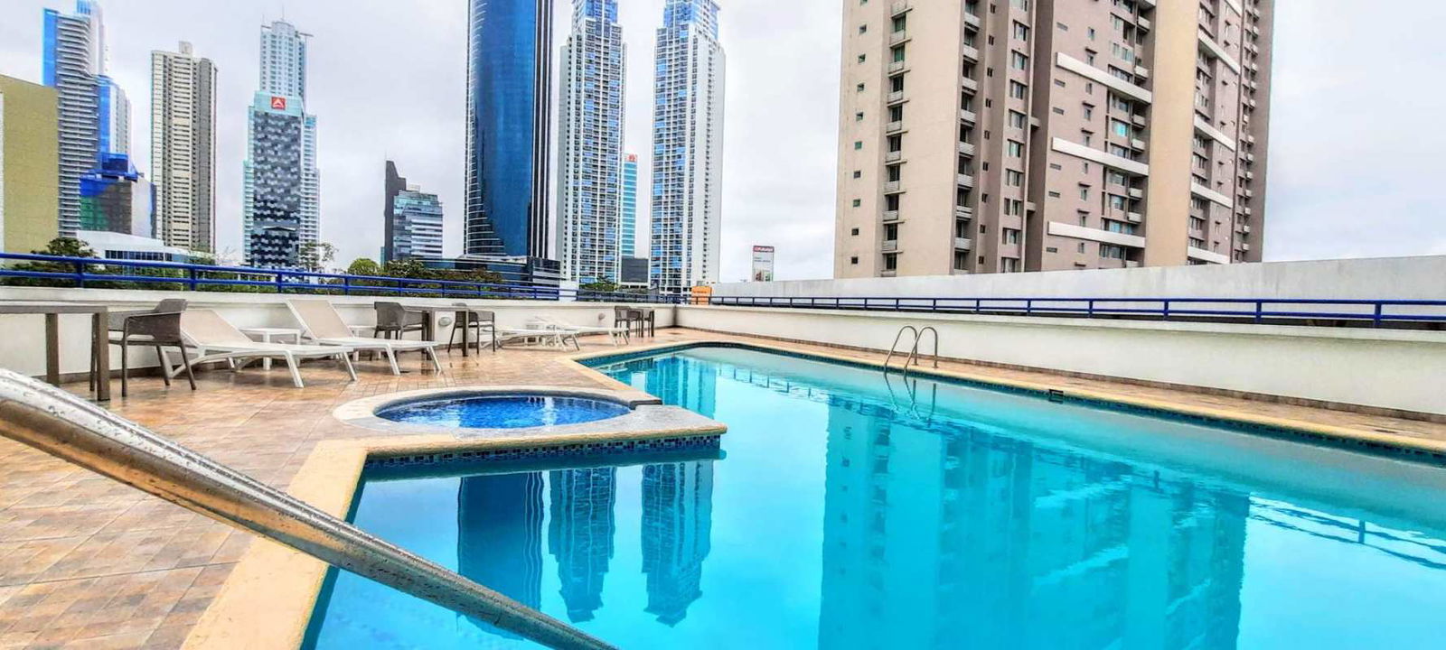 Outdoor swimming pool area with skyline views at PH Costa View Costa del Este Panama