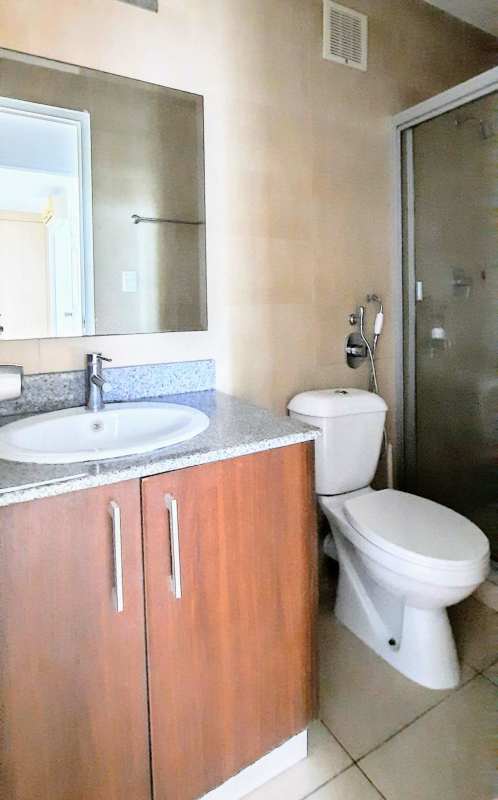 Modern bathroom with glass shower and granite countertop in PH Costa View apartment Panama