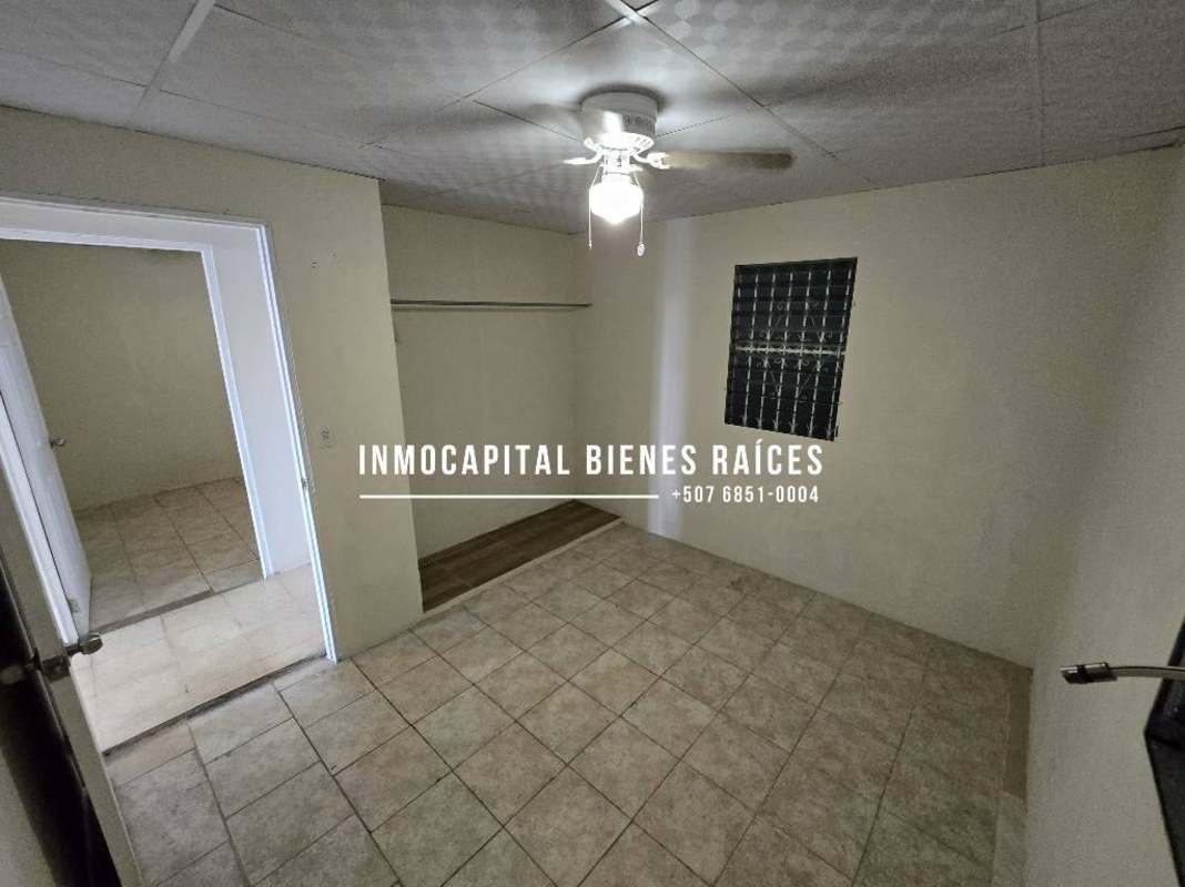 Basic kitchen with laundry sink and tile counters in Don Bosco House Panama