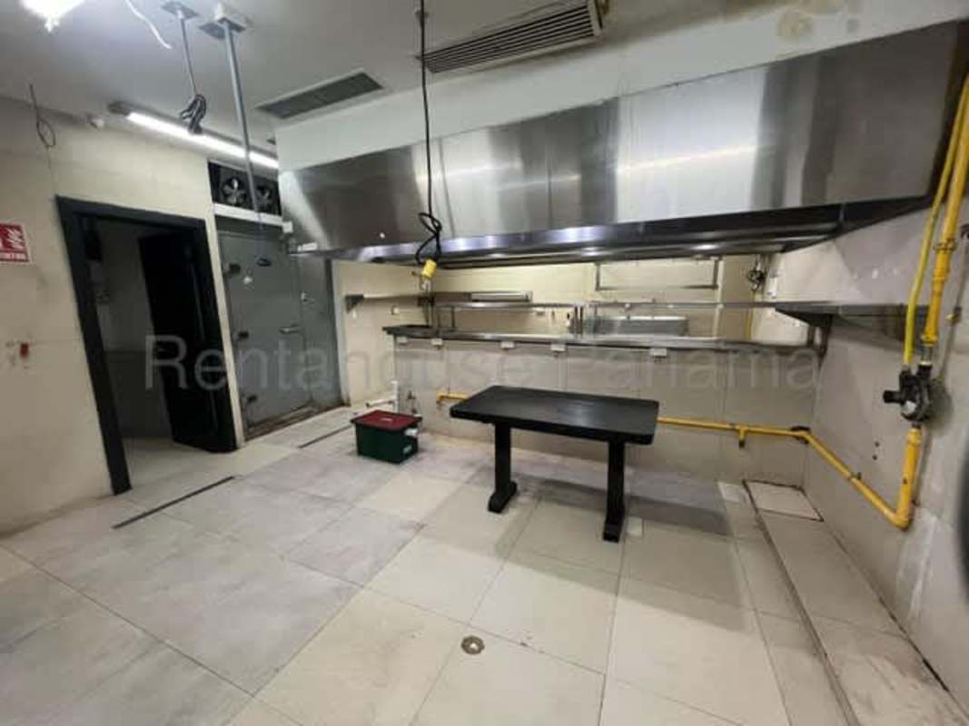 Empty commercial kitchen space with ventilation infrastructure ready for restaurant setup in Panama