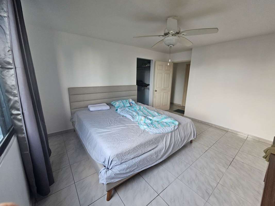 Spacious master bedroom with large windows, closet, and ensuite bath at PH Miraluz Punta Paitilla Panama City