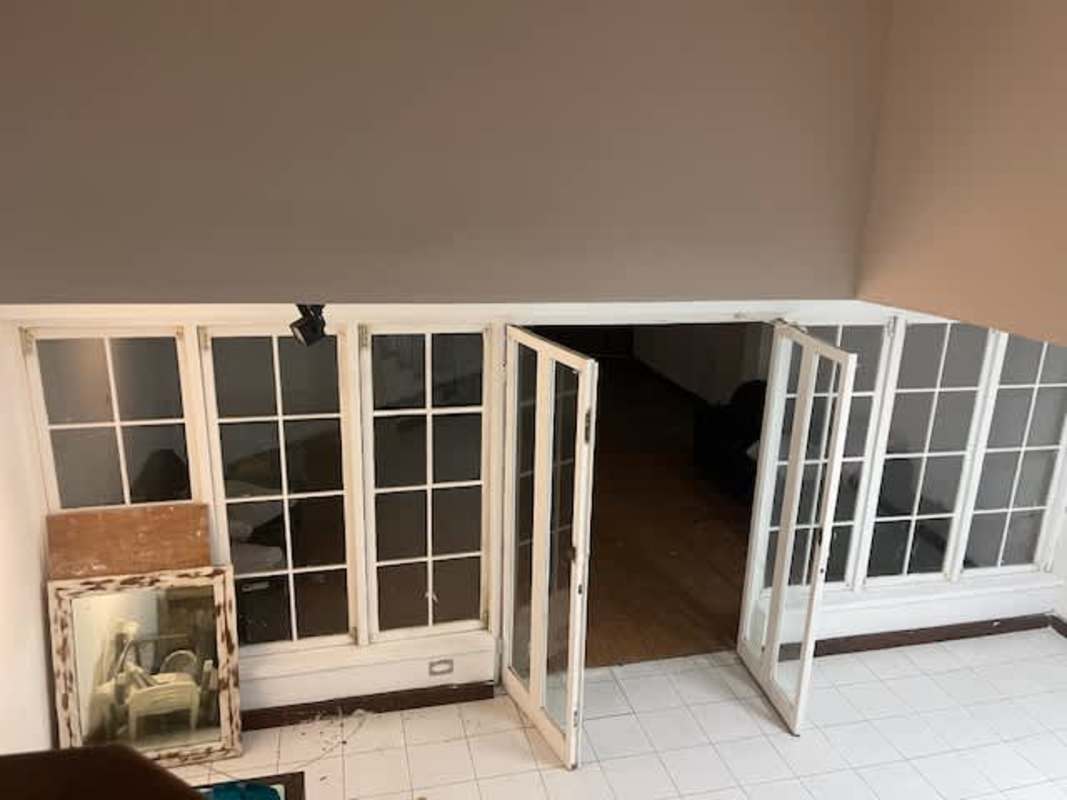 Utility area with tiled floors, window bars enclosed area Obarrio townhouse Panama City