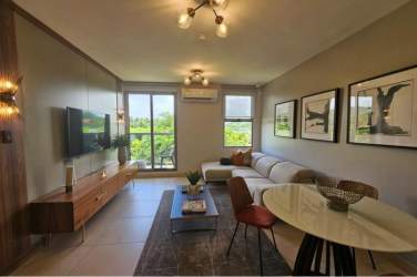 Open living and dining area with natural light, AC and access to balcony PH Parterre Panama Pacifico