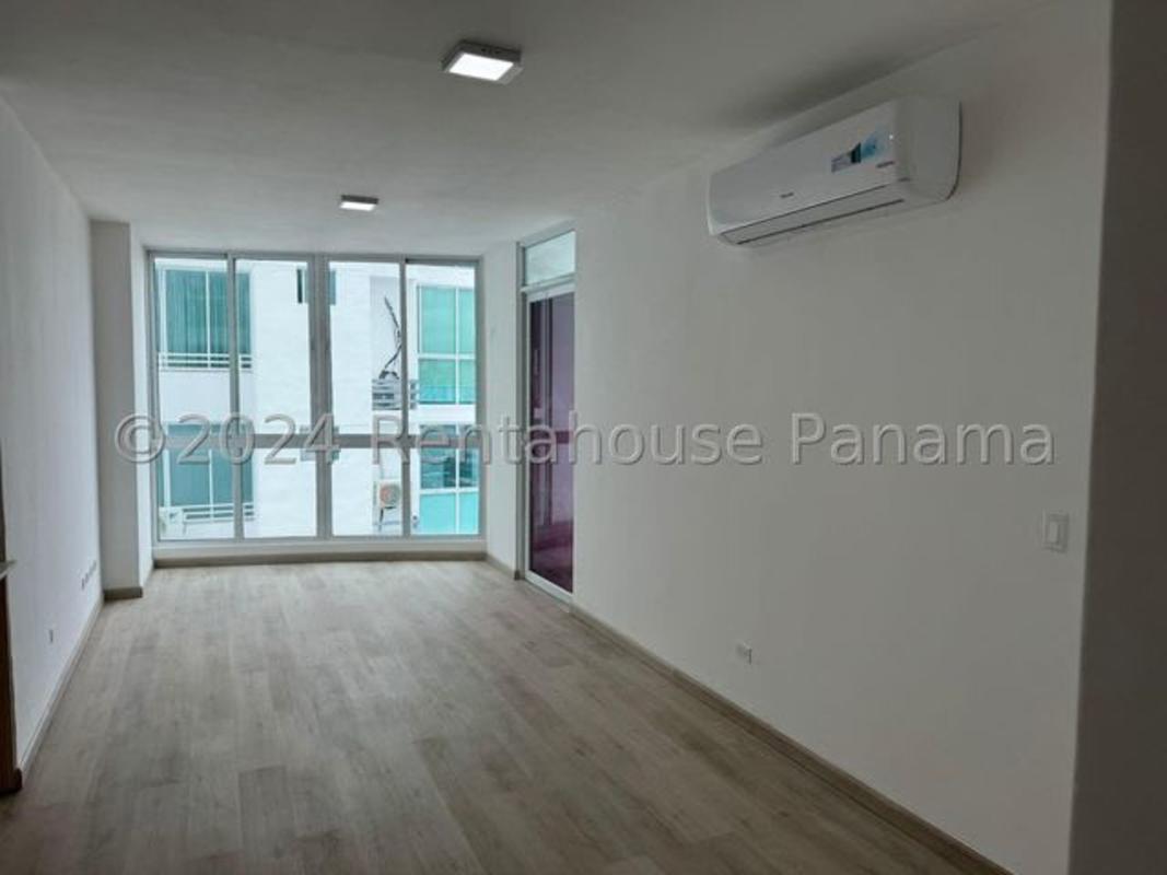 Modern minimalist living-dining open space with large door to balcony, PH The Cosmopolitan Panama City