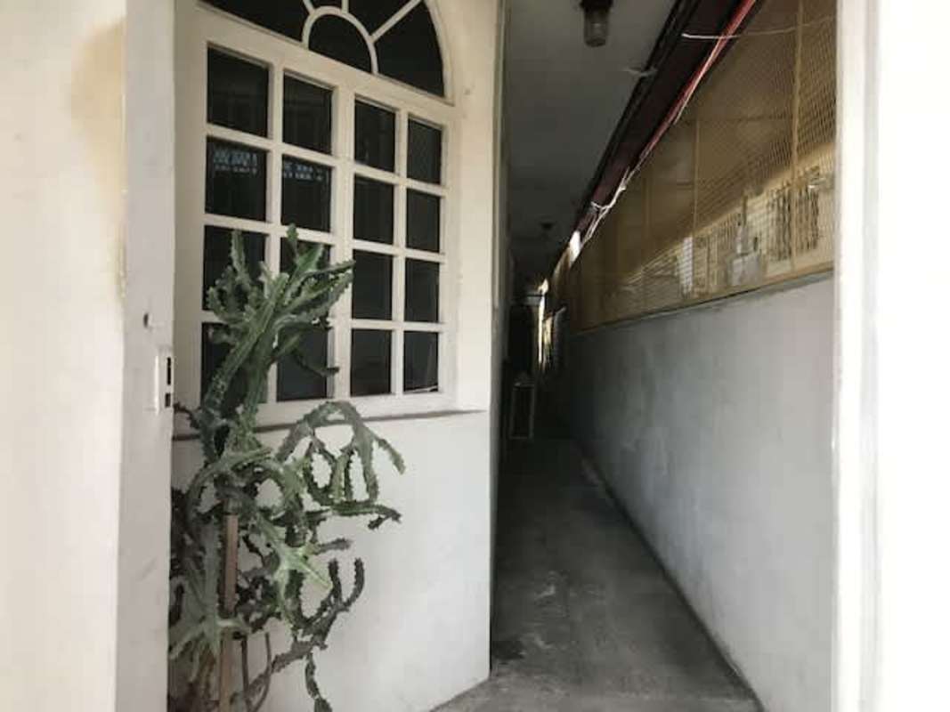 Exterior passageway with security fencing and archway at Villa Cáceres Panama City rentals