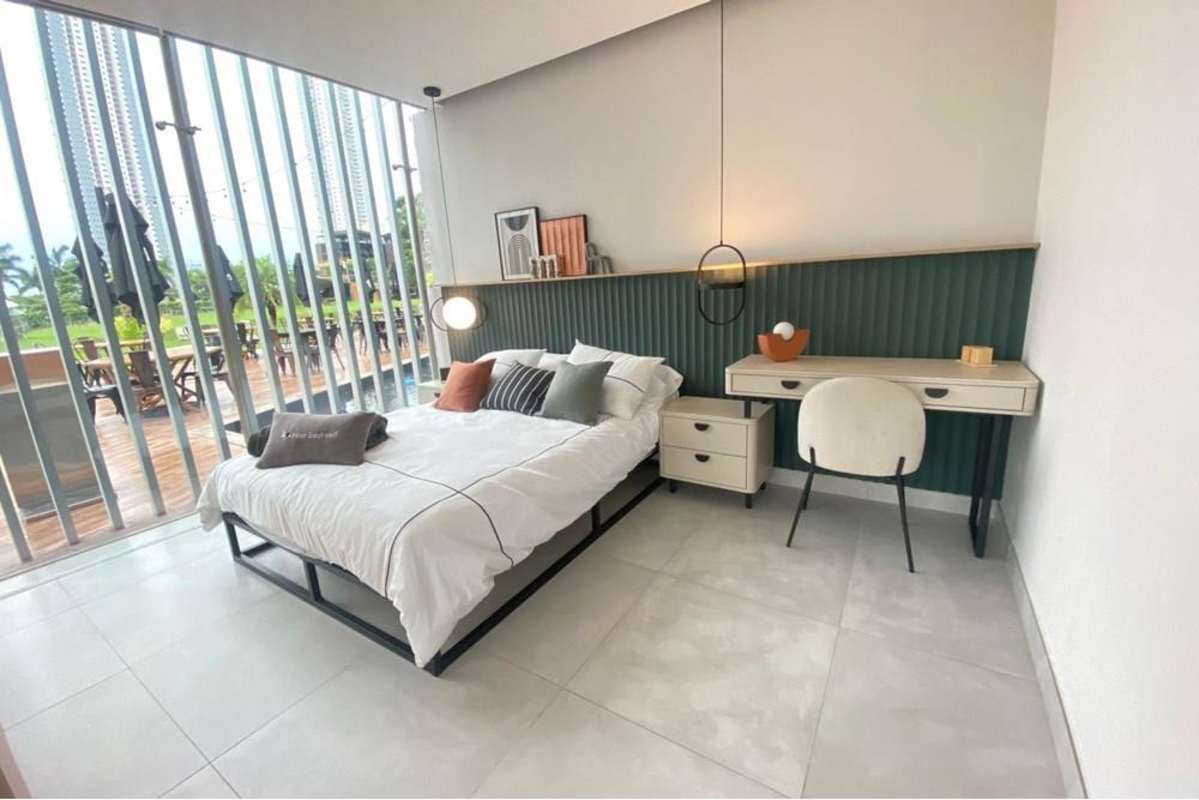 Modern studio bedroom space with floor-to-ceiling windows in Costamare Costa del Este Panama