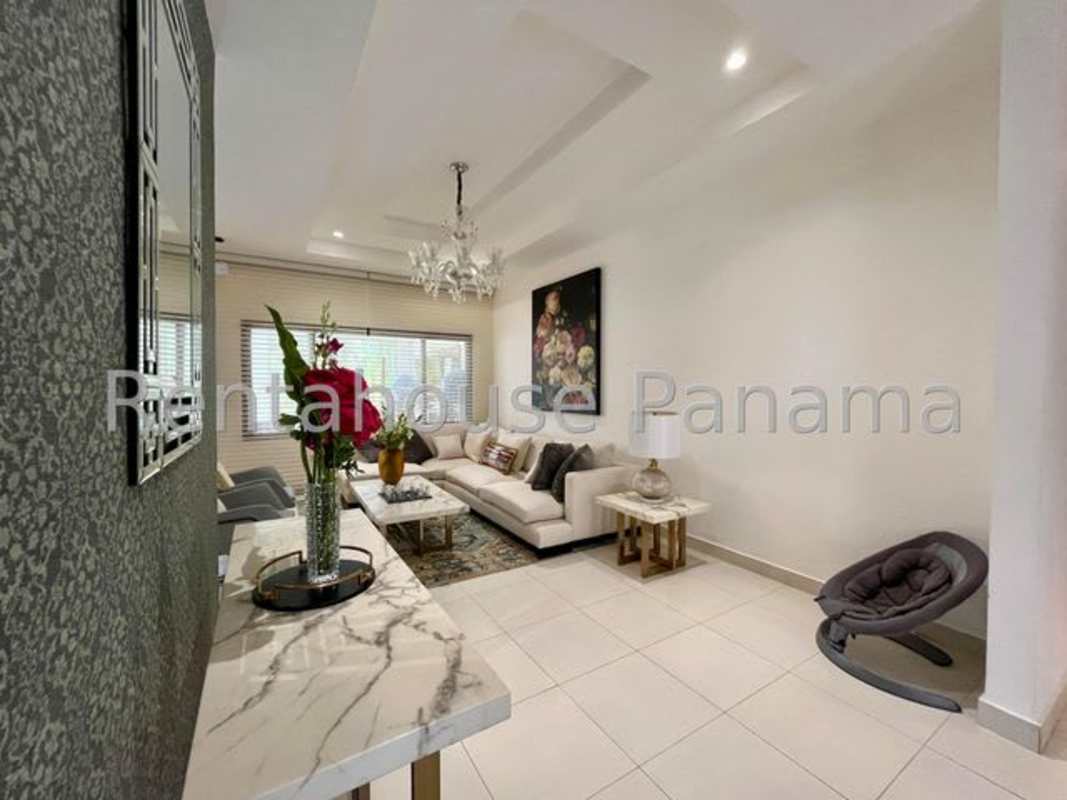 Large modern kitchen with granite countertops and breakfast island in luxury house Sunset Coast Panama City