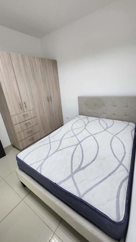 Living dining room with beige furniture large windows Costa del Este Panama rental