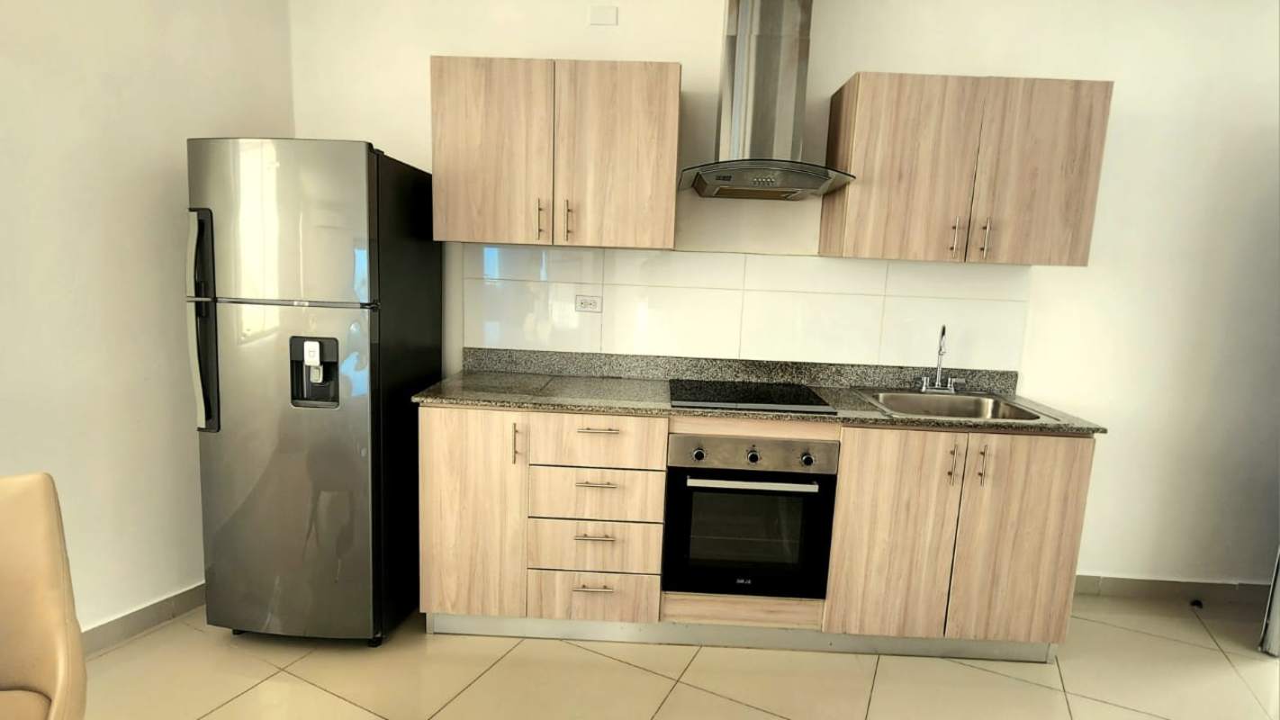 Laundry room with stacked washer dryer in furnished apartment Costa del Este Panama