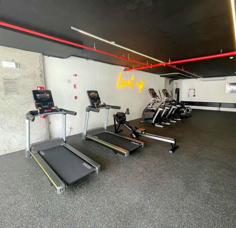 Gym with treadmills and neon lighting, Panama Viejo Residences apartment complex