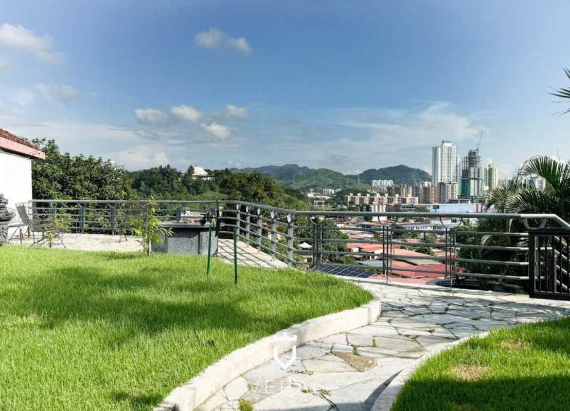 Bright modern living room with large windows and city skyline view Betania Panama