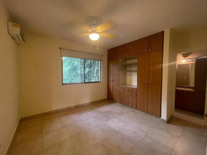 Large master bedroom with ensuite bath, closet, AC, and small balcony Embassy Gardens Clayton Panama