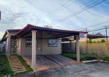 Street view of corner house with fence and gated access Villas de Costa Oeste La Chorrera Panama