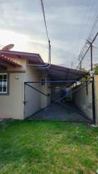 Bright living room with tiled flooring and garden views in Villas de Costa Oeste La Chorrera