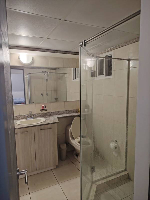 Second bathroom with glass shower in PH Sabana Tower apartment Panama City