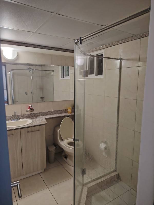 Bedroom featuring marble-style headboard and walk-in closet PH Sabana Tower