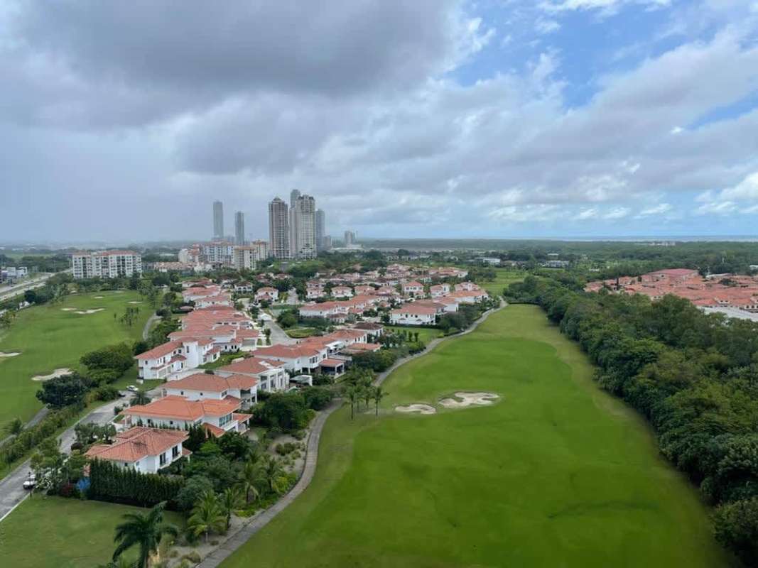 Aerial view of Santa María Golf & Country Club community with lush greens and luxury villas in Panama