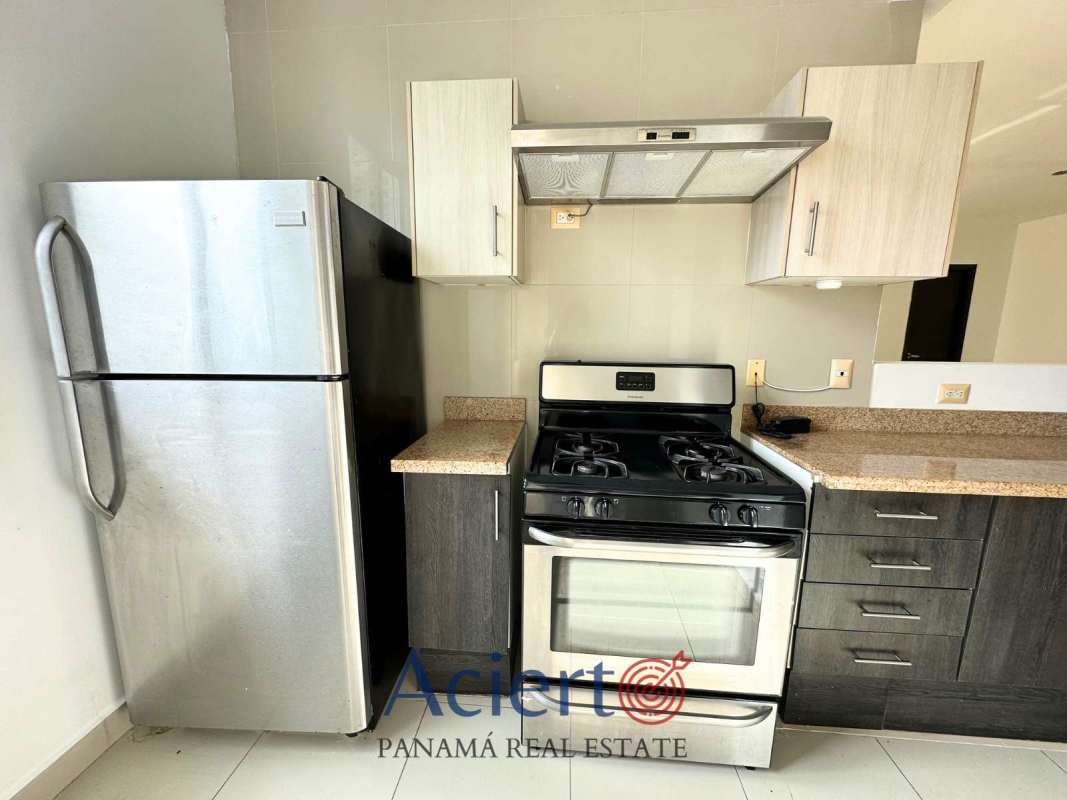 Open space living and dining area with balcony access in investment apartment San Francisco Panama