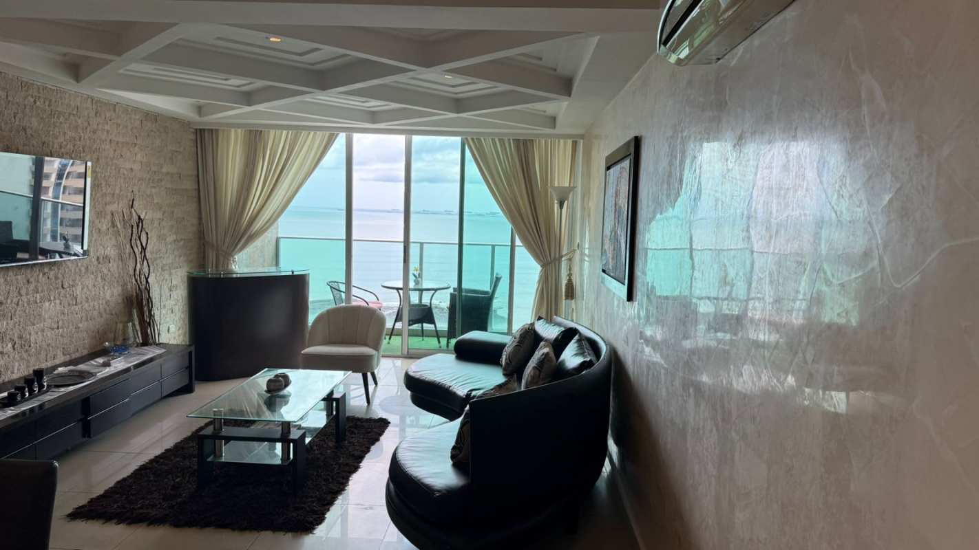 Open concept oceanfront living and dining area with modern furnishings The Ocean Club Panama
