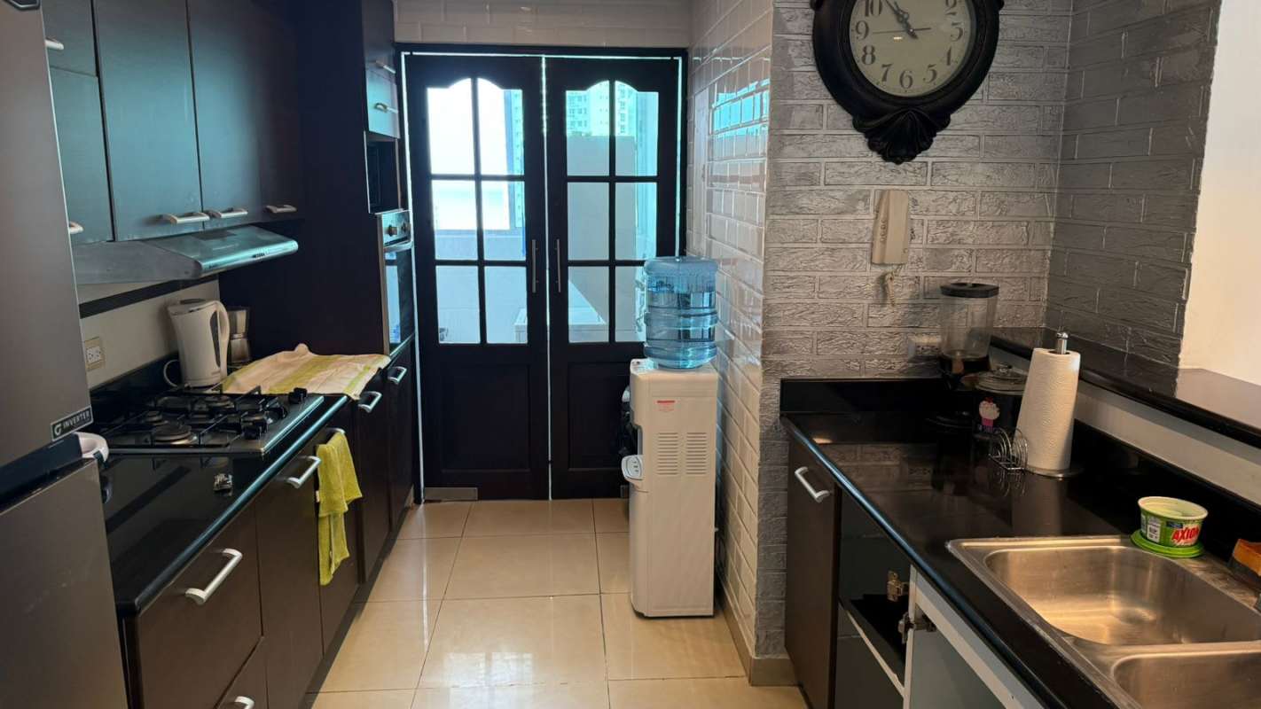 Bathroom with glass shower enclosure, beige tile, modern fixtures The Ocean Club Panama