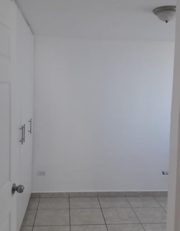 Simple bathroom with tile walls, walk-in shower, sink and toilet PH Sunshine by The Park Panama