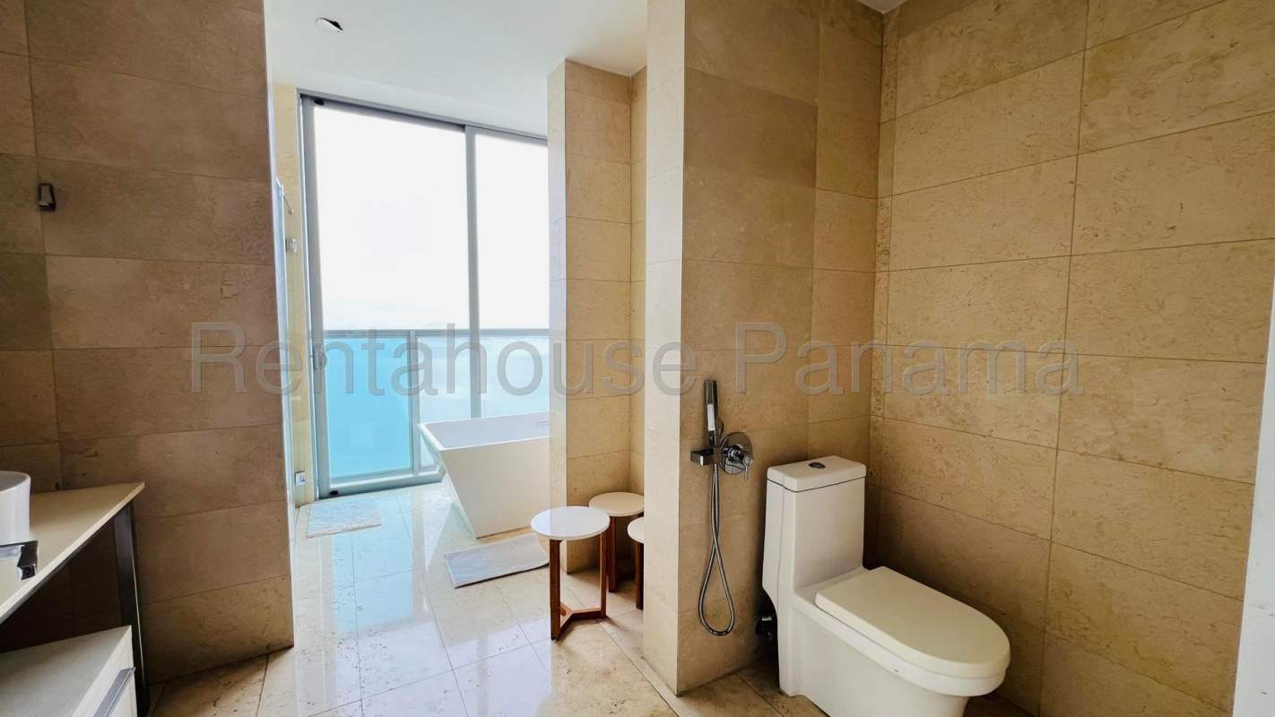 Penthouse bedroom with city skyline & ocean view, marble floor, contemporary décor at PH BICSA Tower Panama